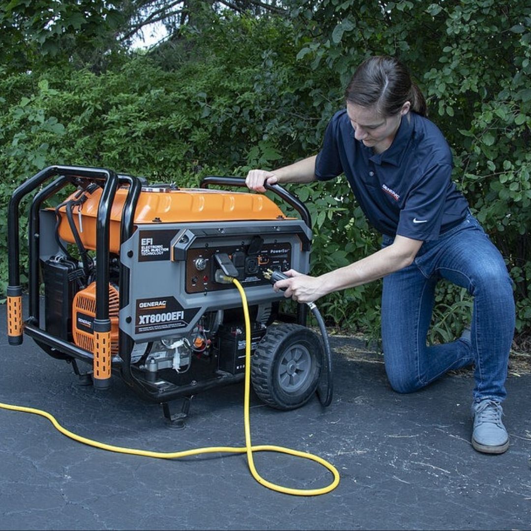 a woman connecting a generator